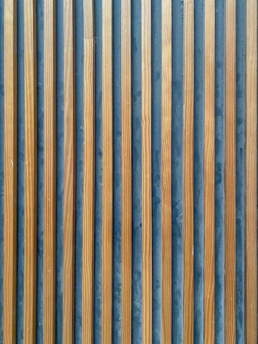 a close up of a metal and wood wall