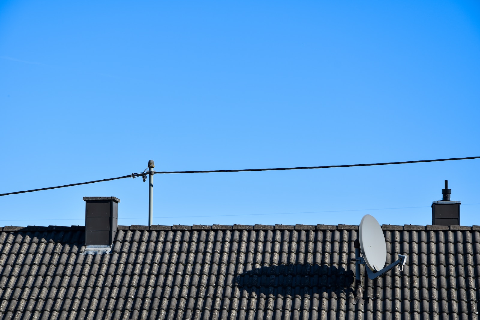 a satellite dish sitting on top of a roof