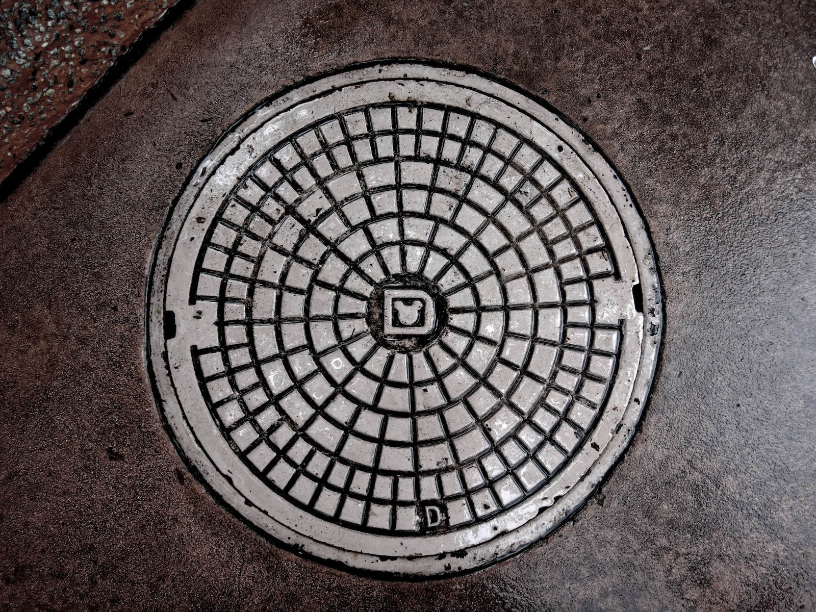 gray manhole cover