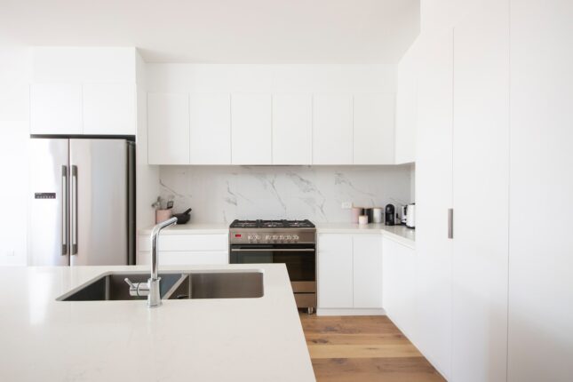 white wooden kitchen cabinet over white kitchen counter