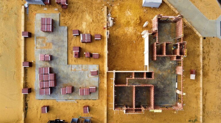 an aerial view of a construction site with tables and chairs